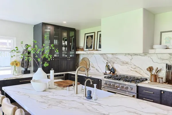 a living room with fireplace furniture and a flat screen tv