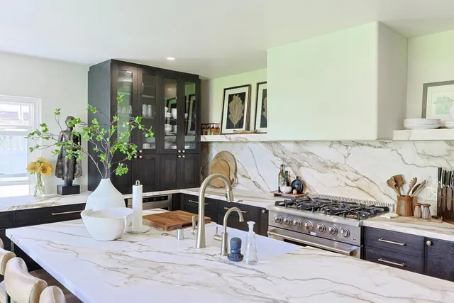 a living room with fireplace furniture and a flat screen tv