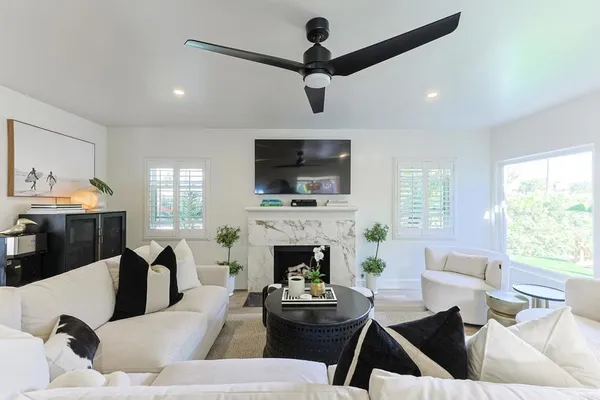 a view of a dining room with furniture and wooden floor