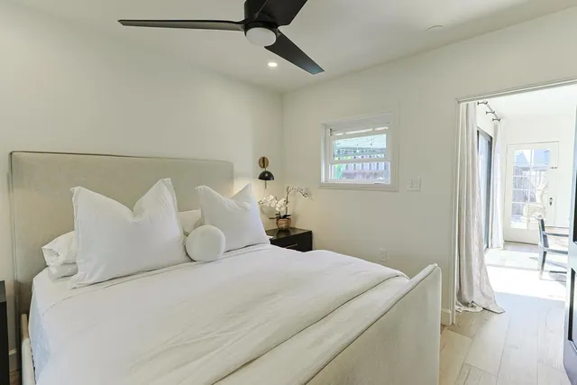 a bedroom with a bed and a lamp