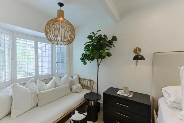 a bathroom with a sink a toilet a mirror and bathtub