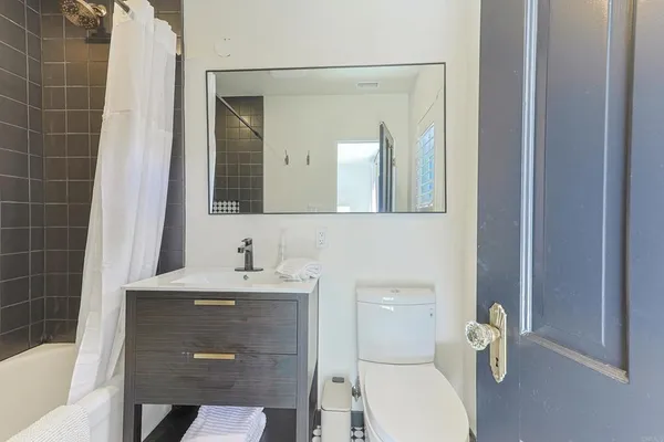 a living room filled with furniture and a chandelier