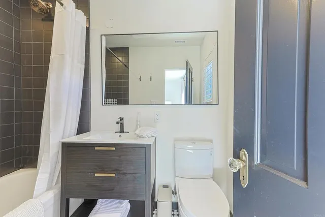 a living room filled with furniture and a chandelier