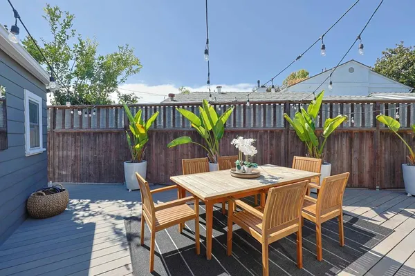 a patio with table and chairs