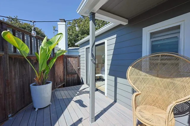 a view of a backyard with potted plants