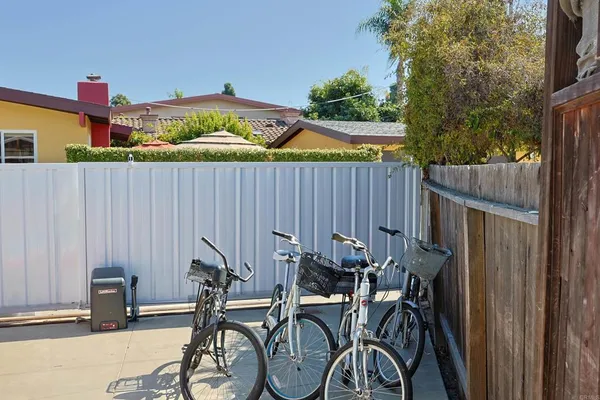a view of a yard with large trees