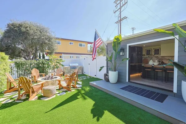a view of a house with a porch and furniture