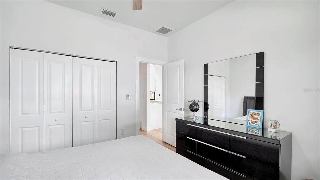 306 East Clay Avenue Brandon, FL 33510 - Photo 15 of 26 a bedroom with a bed and a mirror