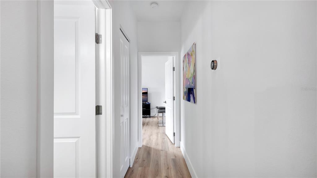 306 East Clay Avenue Brandon, FL 33510 - Photo 16 of 26 a view of a hallway with wooden floor and staircase