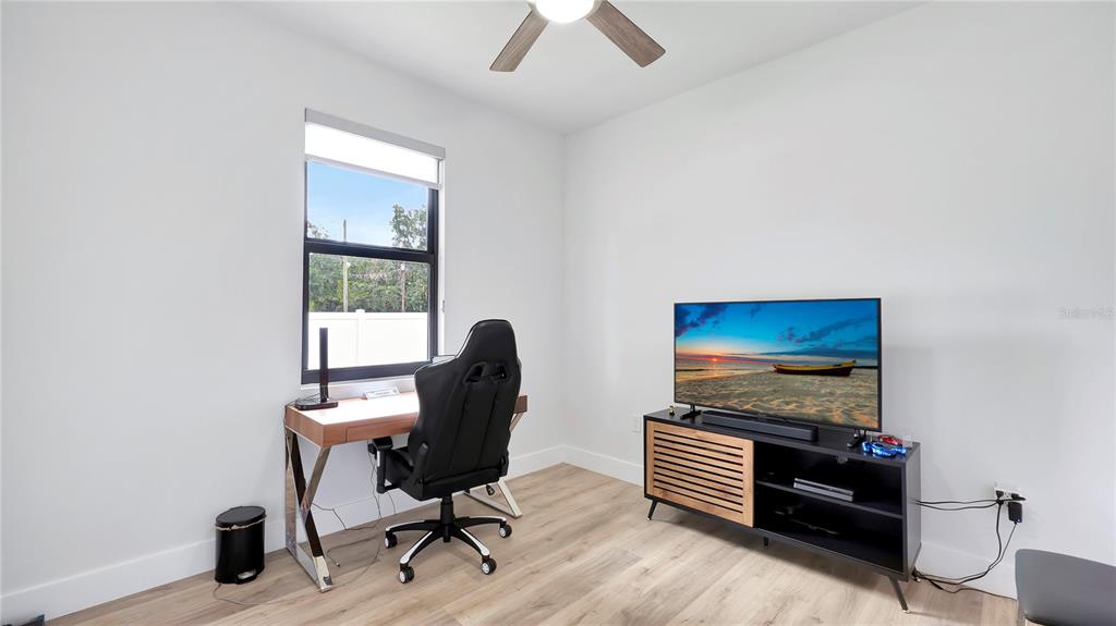 306 East Clay Avenue Brandon, FL 33510 - Photo 19 of 26 a view of a workspace with furniture and a window