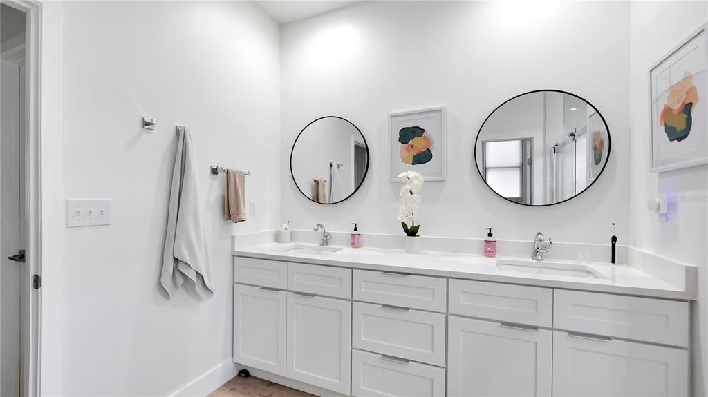 306 East Clay Avenue Brandon, FL 33510 - Photo 24 of 26 a bathroom with a sink and a mirror
