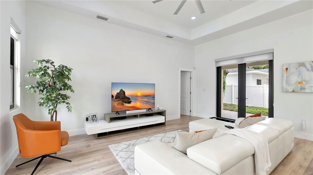 306 East Clay Avenue Brandon, FL 33510 - Photo 4 of 26 a living room with furniture and a flat screen tv