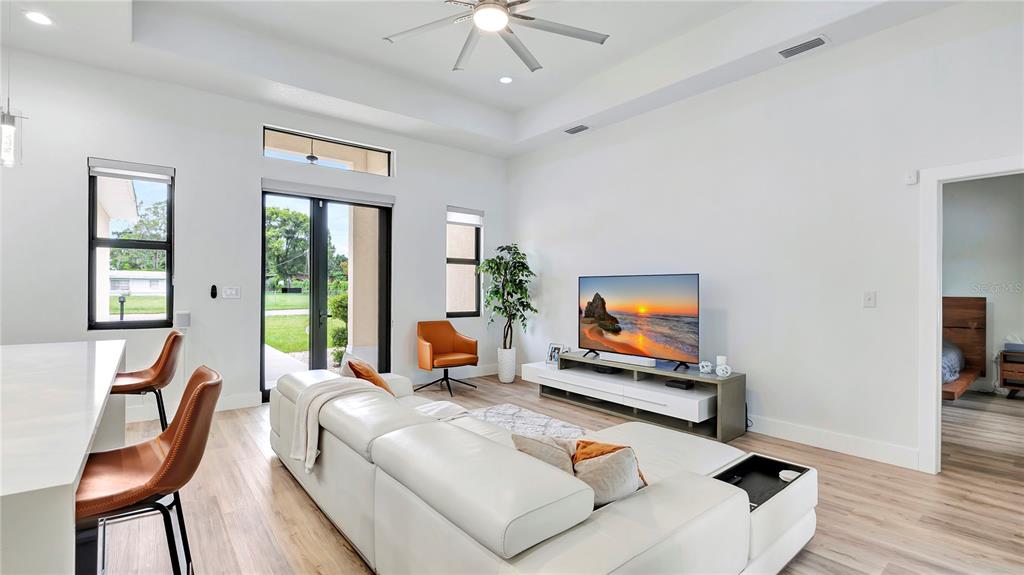 306 East Clay Avenue Brandon, FL 33510 - Photo 10 of 26 a living room with furniture and a flat screen tv