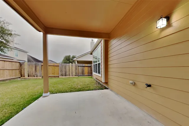 a view of a back yard of the house