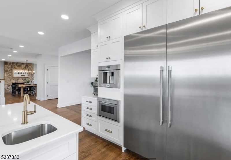 134 Hillsborough Road Hillsborough, NJ 08844 - Photo 14 of 50 a kitchen with a refrigerator sink and cabinets