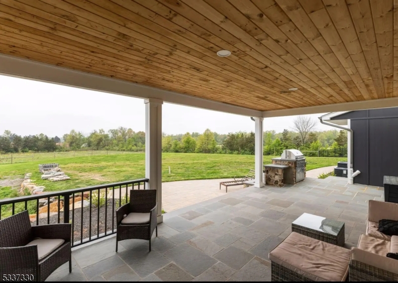 134 Hillsborough Road Hillsborough, NJ 08844 - Photo 17 of 50 a view of a patio with chairs and floor to ceiling window