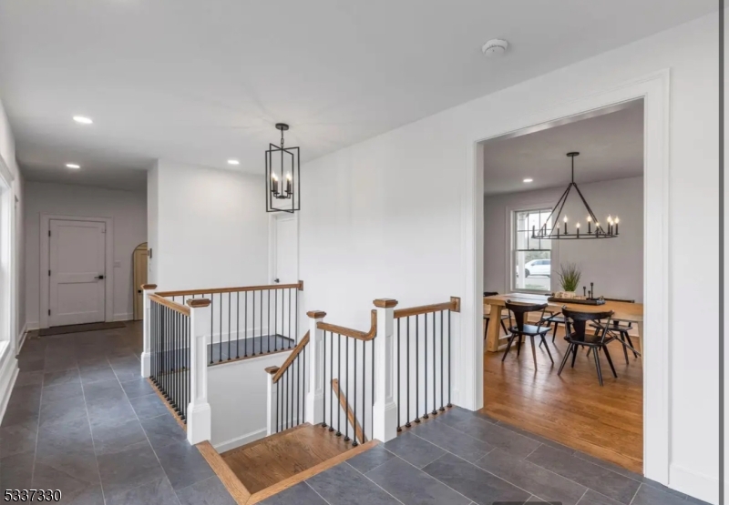 134 Hillsborough Road Hillsborough, NJ 08844 - Photo 21 of 50 a view of a dining room with furniture wooden floor and chandelier