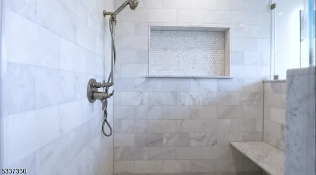 a spacious bathroom with a granite countertop sink mirror and toilet