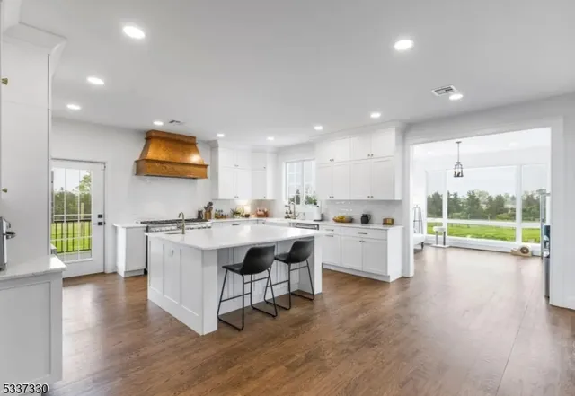 a kitchen with cabinets and window