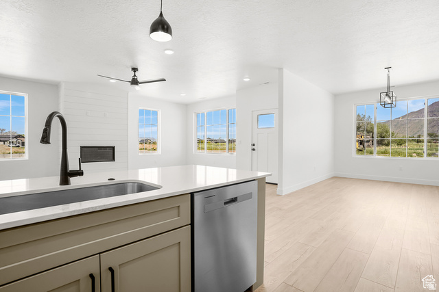 1631 West Century Lane, Unit C Mapleton, UT 84664 - Photo 12 of 31 Kitchen island with an undermount sink and matte black faucet