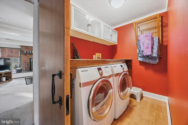a utility room with dryer and washer