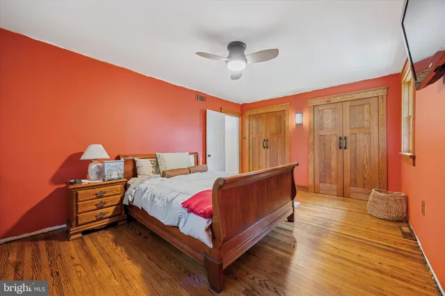 a bed room with a bed and a chandelier