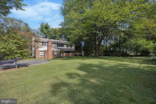 a view of a house with a big yard