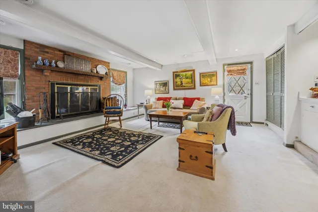 a living room with furniture and a rug