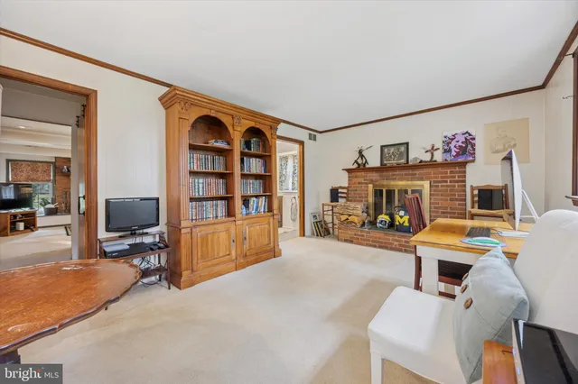 a view of a livingroom with furniture and a flat screen tv