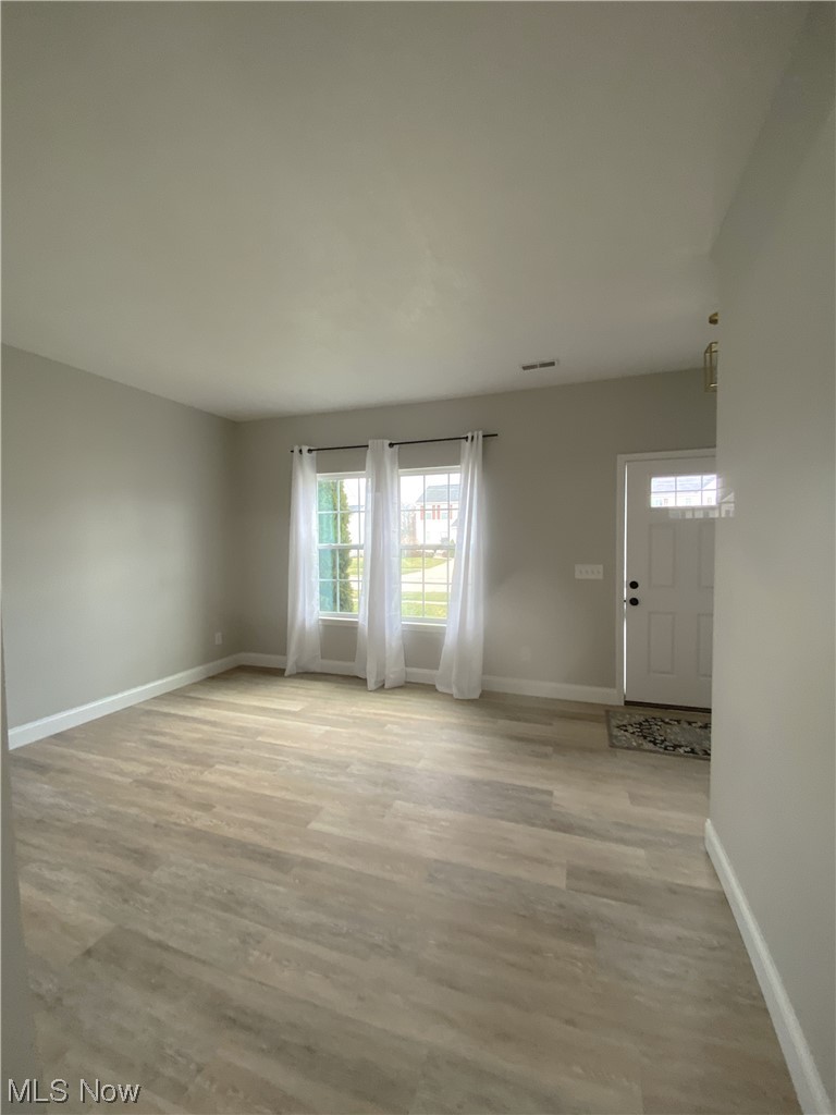 2113 Fowl Road Elyria, OH 44035 - Photo 5 of 39 Another view of front living room featuring light wood-type flooring