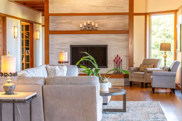 a living room with furniture and a fireplace