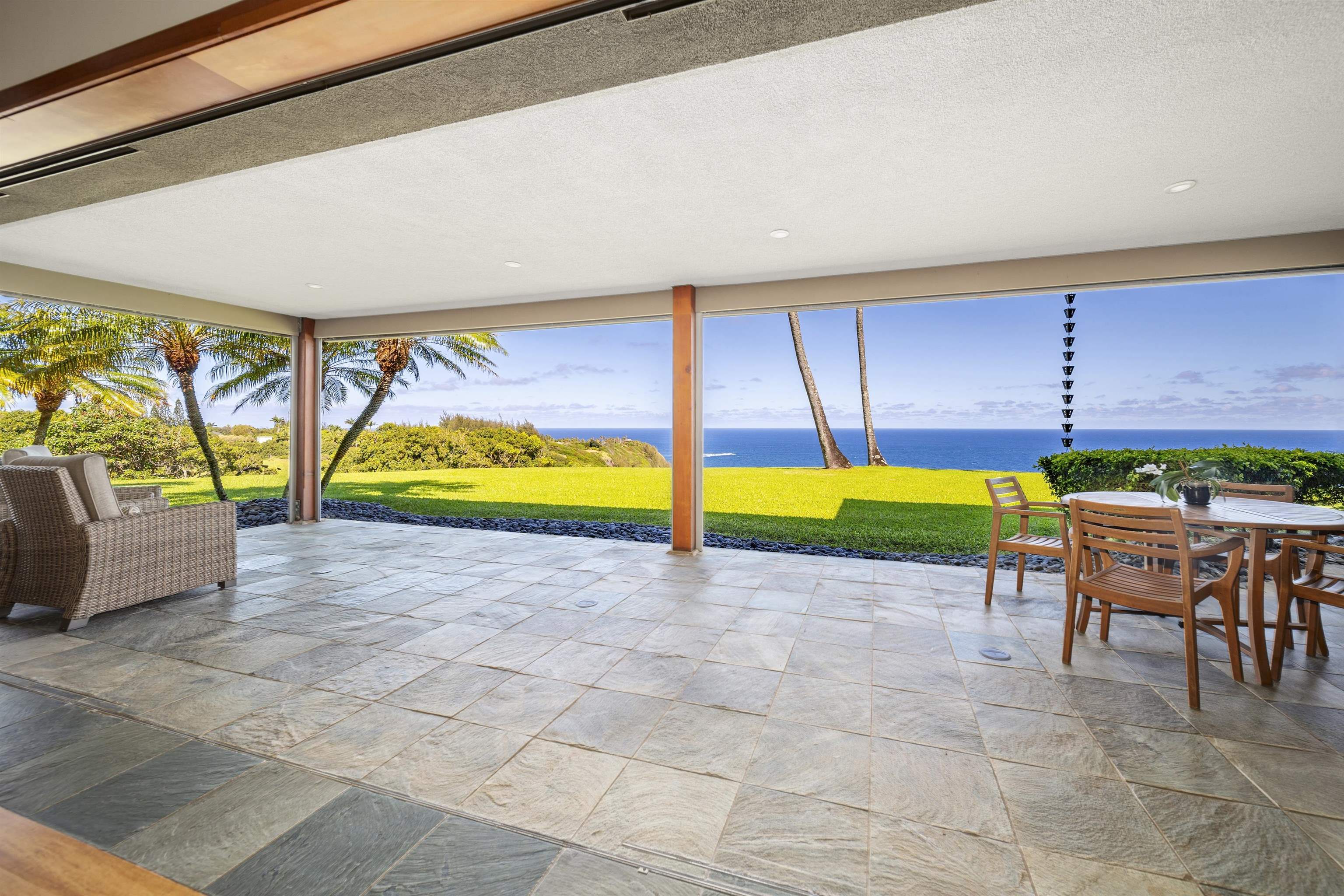 400 Mehana Road Haiku, HI 96708 - Photo 18 of 50 a view of a swimming pool with a table and chairs under an umbrella
