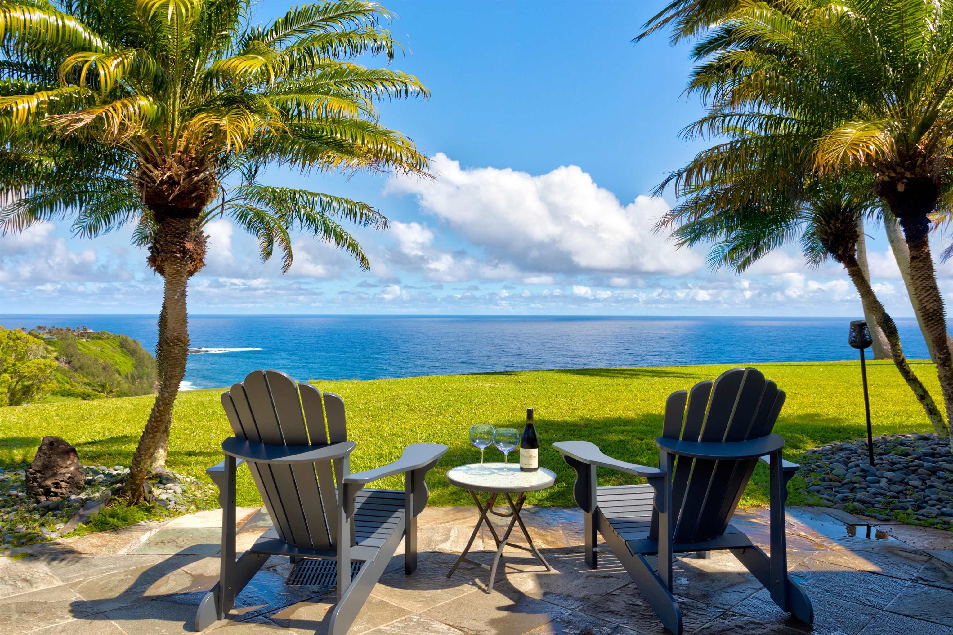 400 Mehana Road Haiku, HI 96708 - Photo 19 of 50 a view of an outdoor sitting area with furniture and umbrella