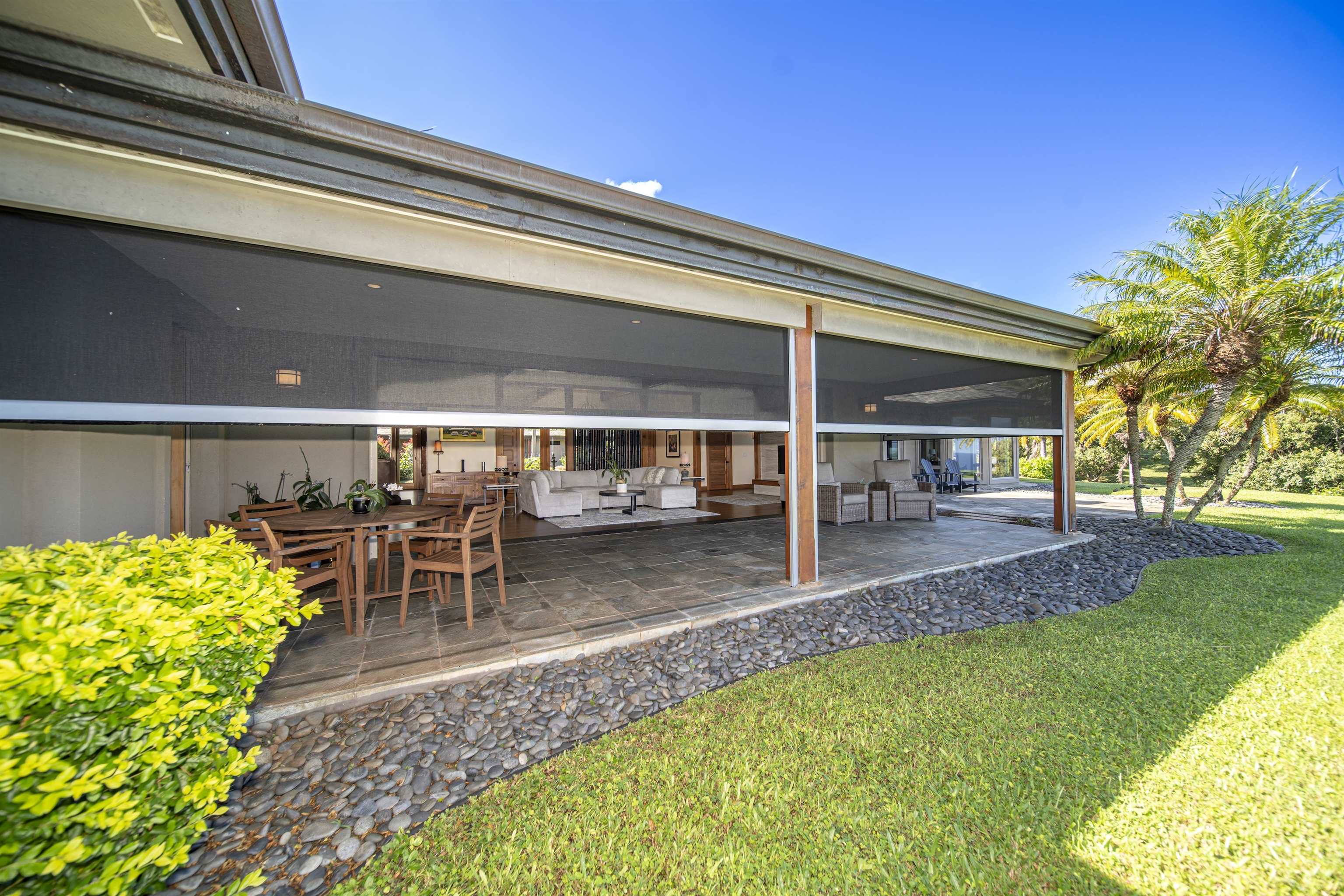 400 Mehana Road Haiku, HI 96708 - Photo 21 of 50 a view of a porch with chairs and table