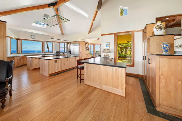 a kitchen with stainless steel appliances a sink and a large window