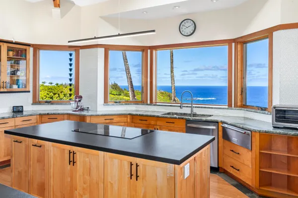 a kitchen with a sink and a large window