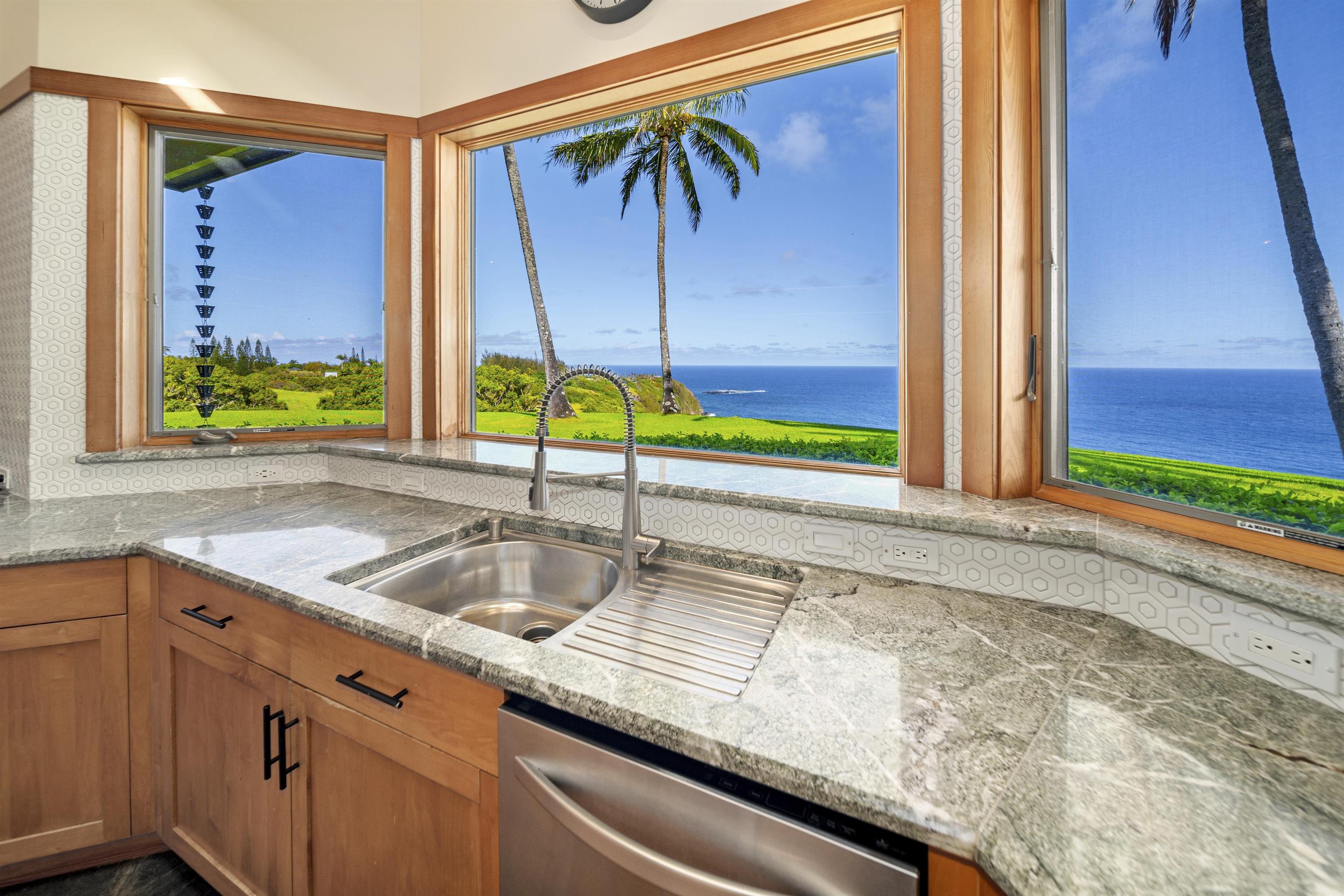 400 Mehana Road Haiku, HI 96708 - Photo 25 of 50 a kitchen with a sink and a large window
