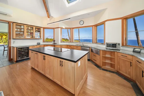 a kitchen with stainless steel appliances granite countertop a stove and a refrigerator