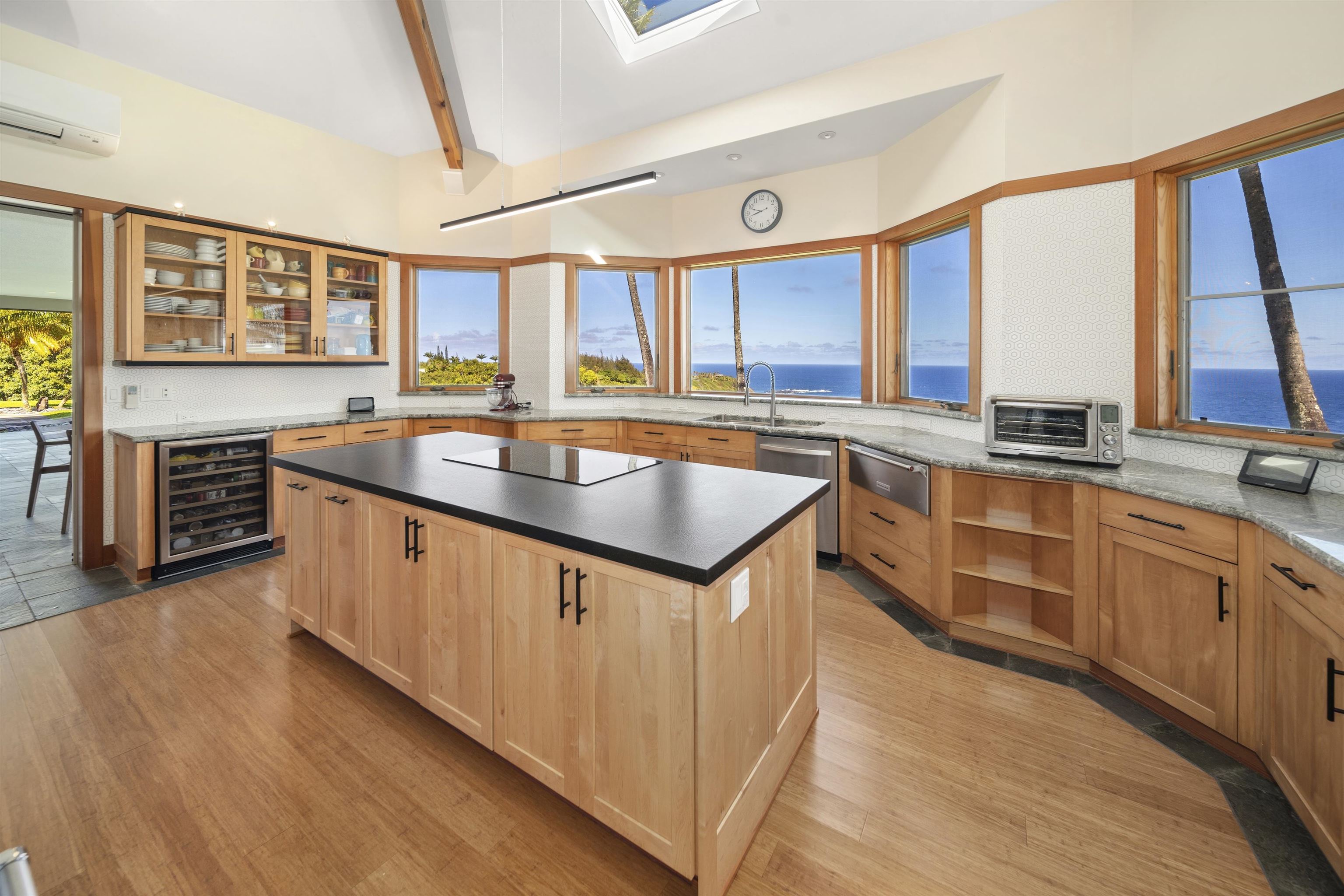 400 Mehana Road Haiku, HI 96708 - Photo 26 of 50 a kitchen with stainless steel appliances granite countertop a sink and a stove