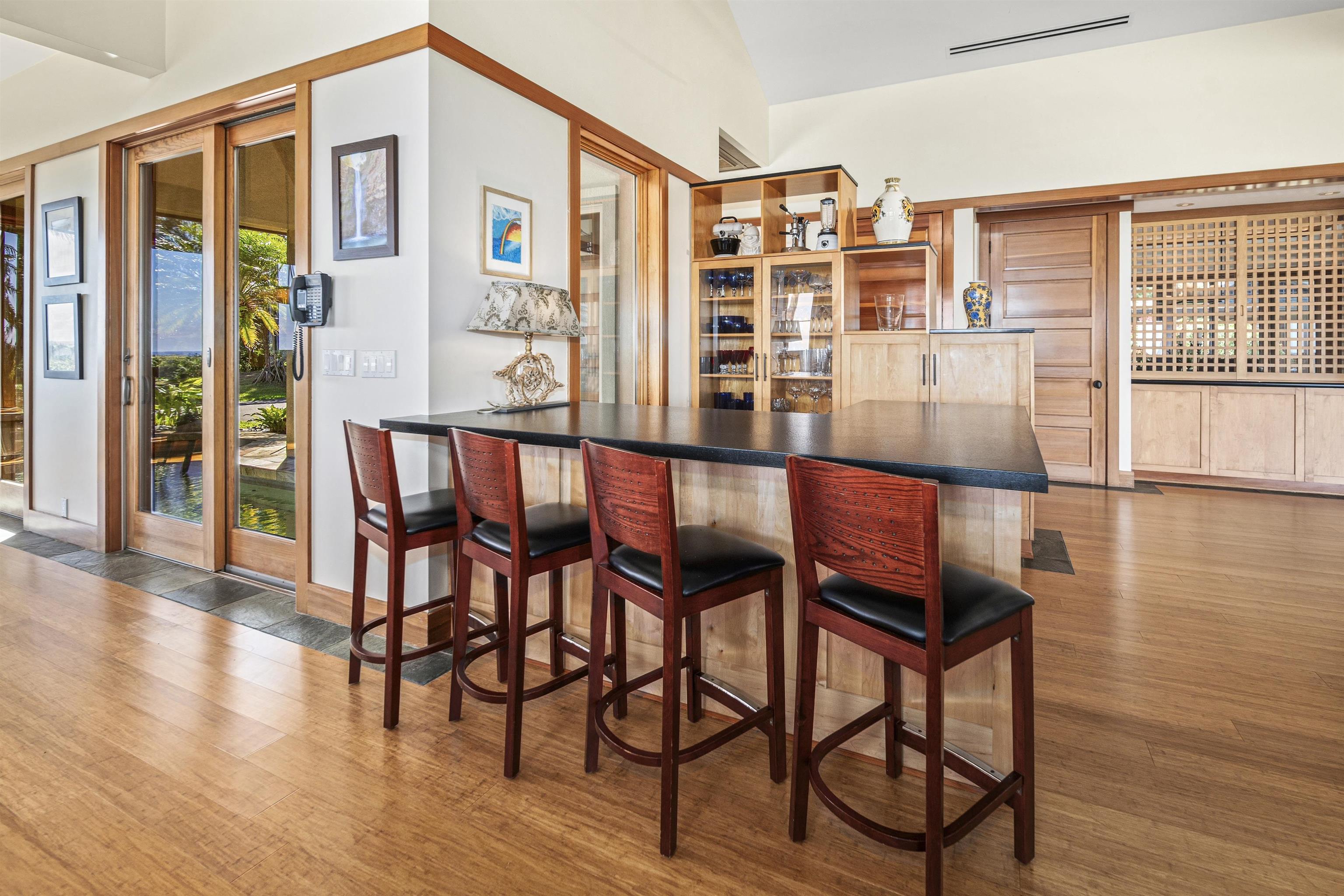 400 Mehana Road Haiku, HI 96708 - Photo 28 of 50 a dining room with furniture and wooden floor
