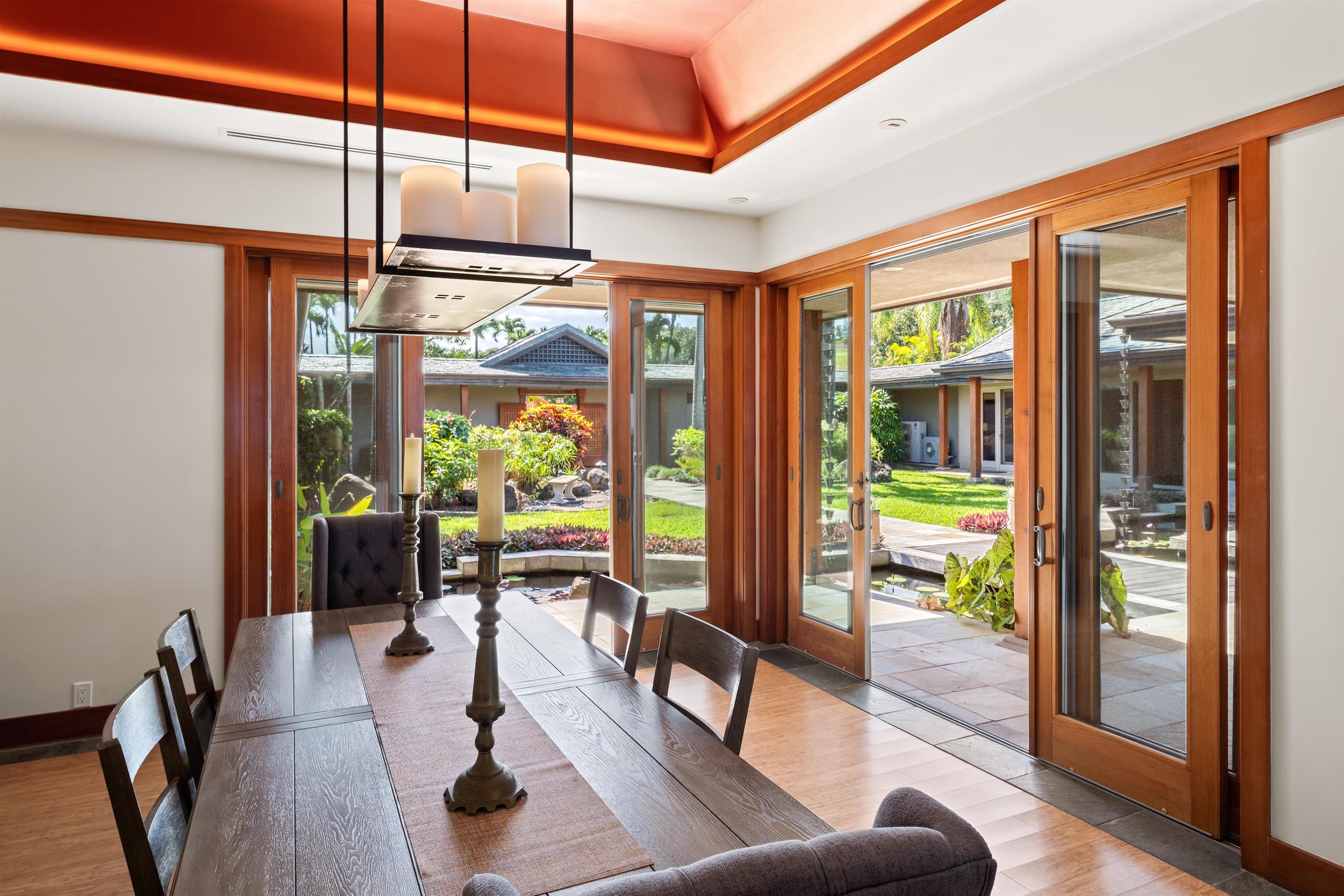 400 Mehana Road Haiku, HI 96708 - Photo 30 of 50 a living room with furniture and floor to ceiling windows