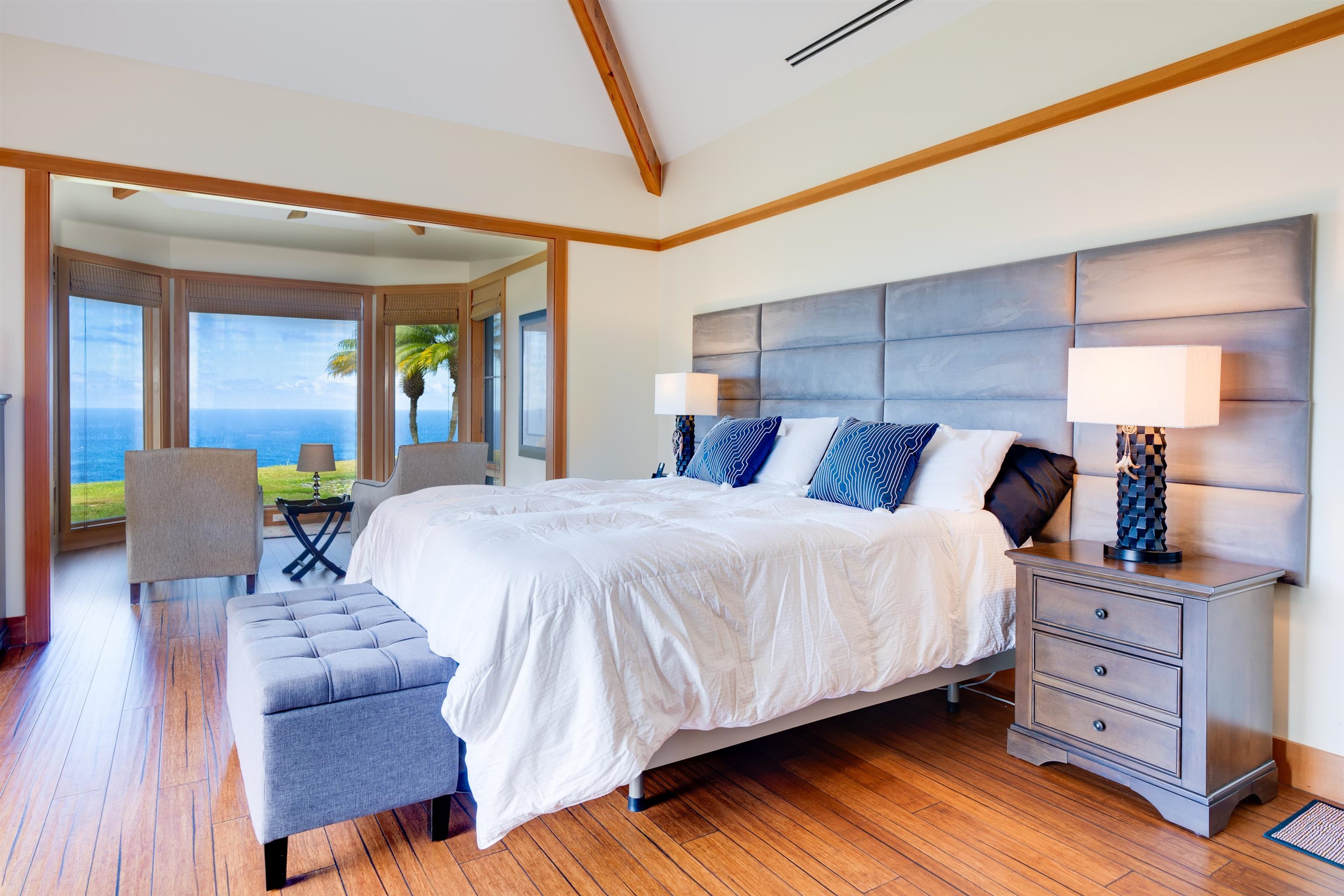 400 Mehana Road Haiku, HI 96708 - Photo 34 of 50 a bedroom with a bed and wooden floor