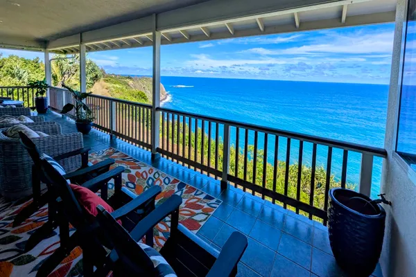 a kitchen with stainless steel appliances granite countertop a refrigerator a stove top oven a sink dishwasher and wooden cabinets with wooden floor