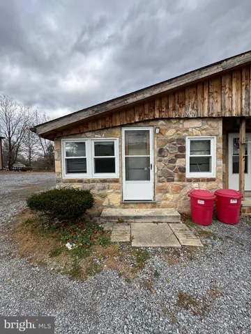 a front view of a house with outdoor space