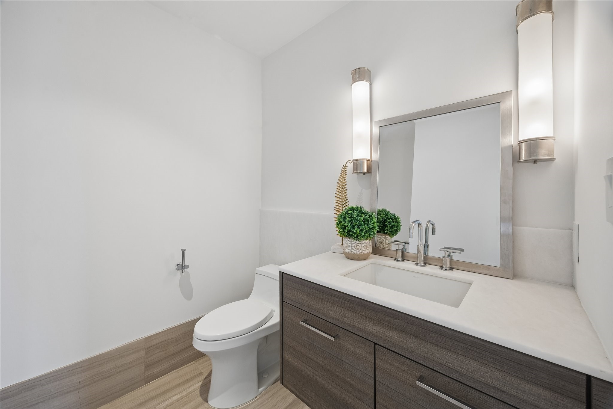 3433 Westheimer Road, Unit 702 Houston, TX 77027 - Photo 30 of 48 A beautifully appointed powder room offers understated elegance for guests.