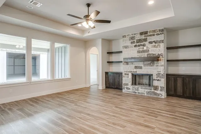 a view of a kitchen with furniture and a fireplace