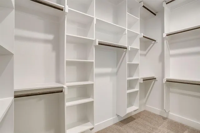 a view of an empty walk in closet