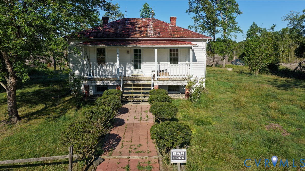 11700 Cosby Mill Road New Kent, VA 23124 - Photo 13 of 17 a front view of a house with a yard