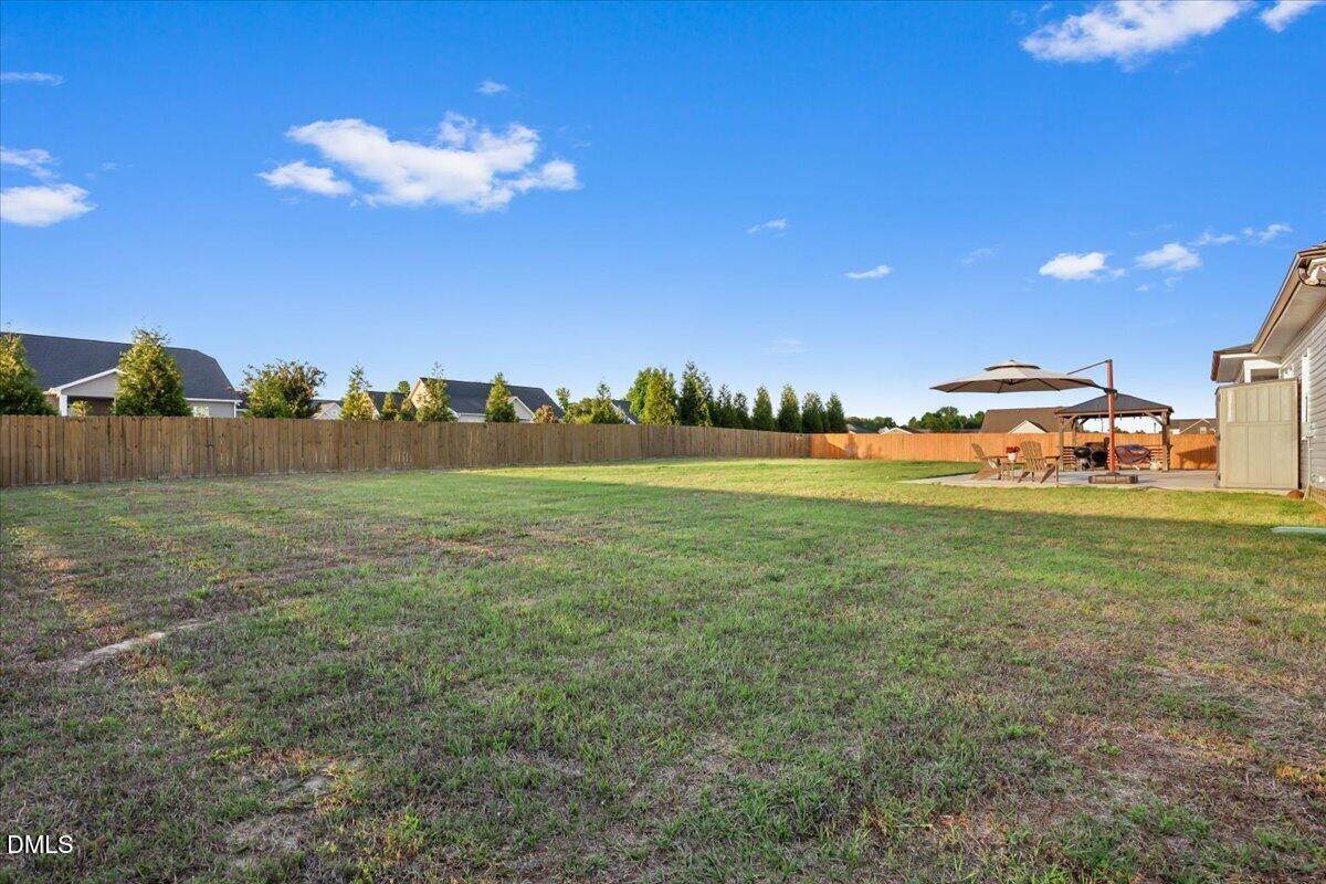 88 Heath Road Lillington, NC 27546 - Photo 25 of 54 a view of a golf course with a lake