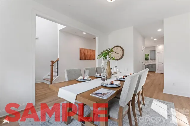 a dining room with furniture and wooden floor